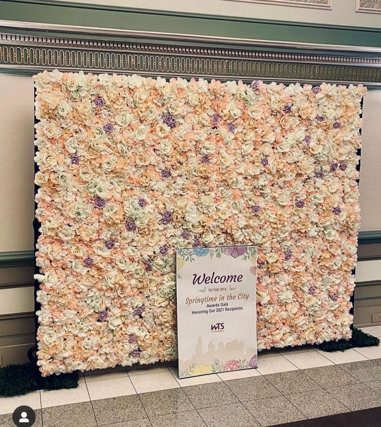 Floral wall with welcome sign