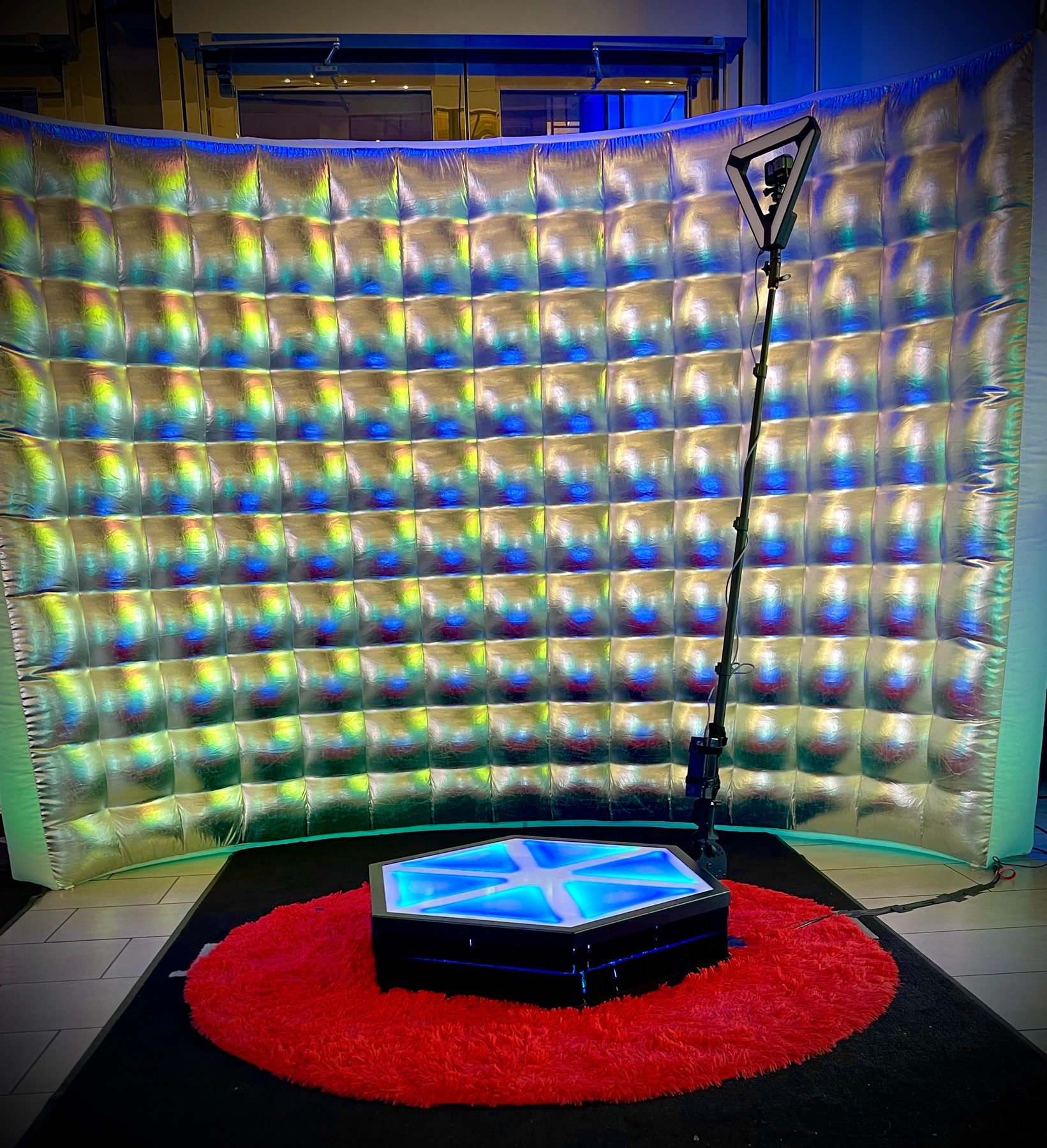 360 video booth with glow wall backdrop